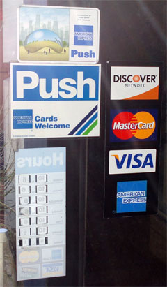 photo of credit card logos on retail store in Chicago