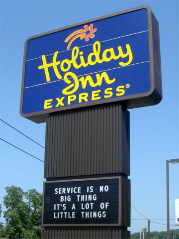 photo of Holiday Inn Express sign reading, Service is no Big Thing, It’s a lot of Little Things