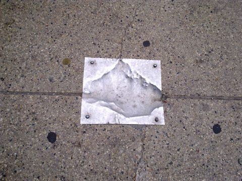 photo of metal sidewalk patch in Chicago