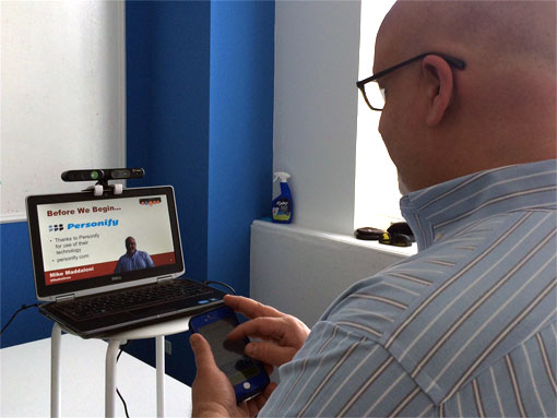 photo of remote presentation using Personify Plus with 3D camera and mobile app