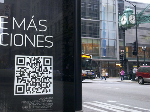 photo of bus Stop ad in Spanish with QR code and Marshall Field’s, Chicago