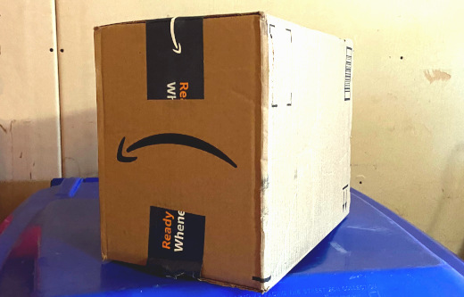 photo of upside-down Amazon box frowning
