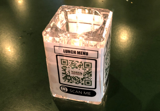 photo of menu QR code on table candle