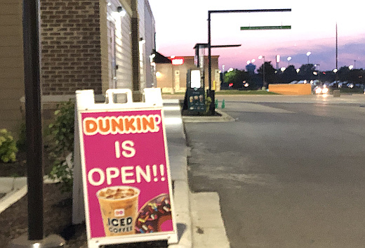 photo of Dunkin sign by closed Starbucks drive thru photo of Dunkin sign by closed Starbucks drive thru