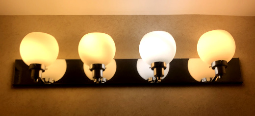 photo of hotel bathroom light fixture with different bulbs