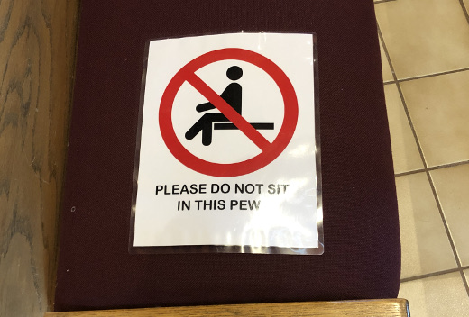 photo of sign at church to not sit in this pew