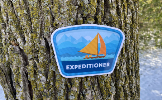 photo of Trailhead Expeditioner badge on a tree